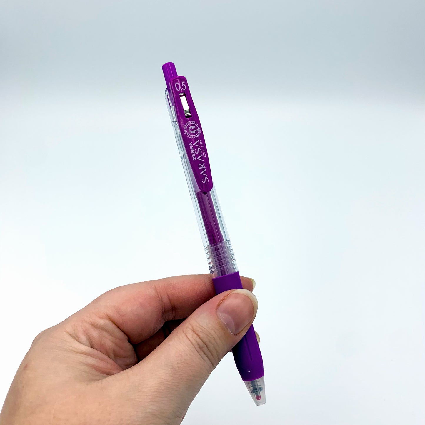 Zebra Violet Sarasa Clip Pen in hand - Paper Dream