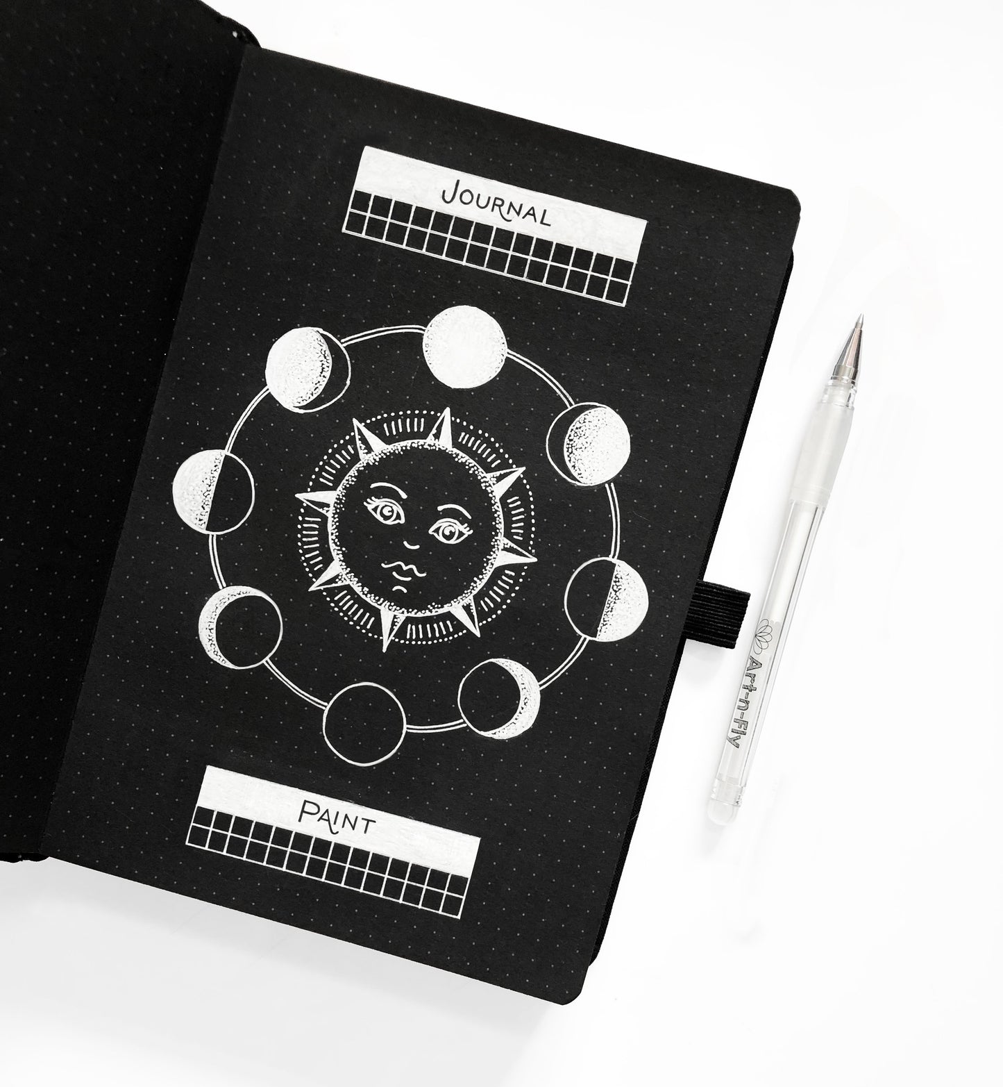 Archer and Olive blackout dot grid bullet journal white drawing